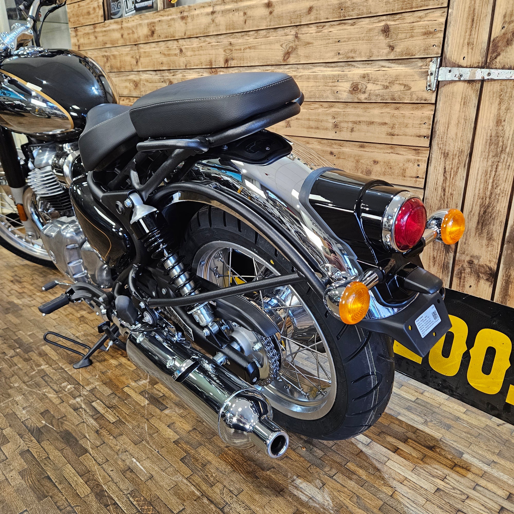 Motorcycle with visible branding on a wooden floor