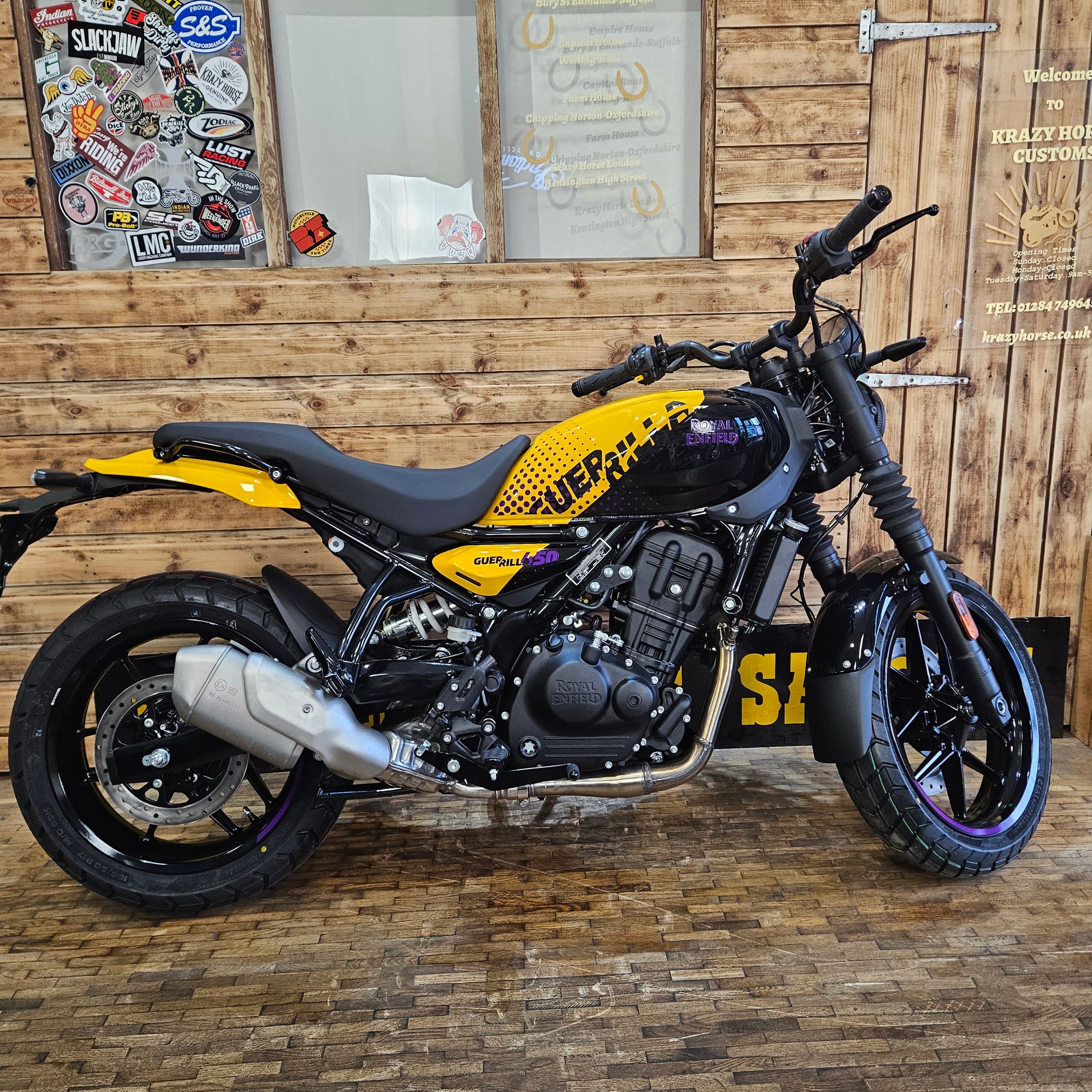 Motorcycle with visible branding on a wooden wall