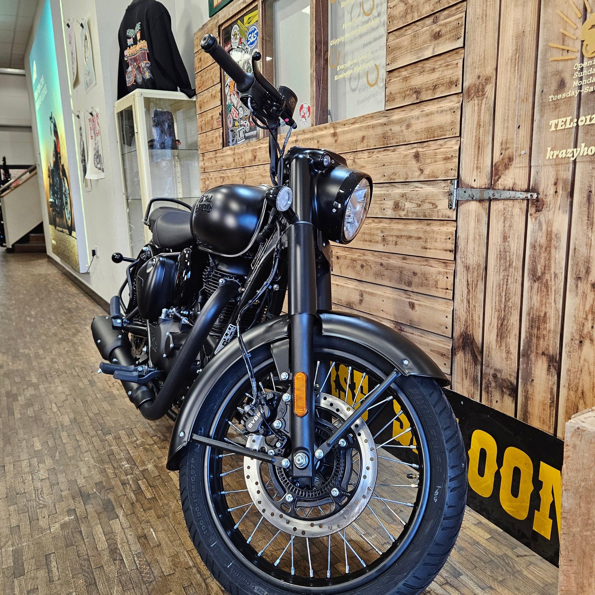 Motorcycle indoors with wooden floor and wall