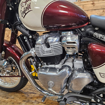 Close-up of a motorcycle engine with a wooden background