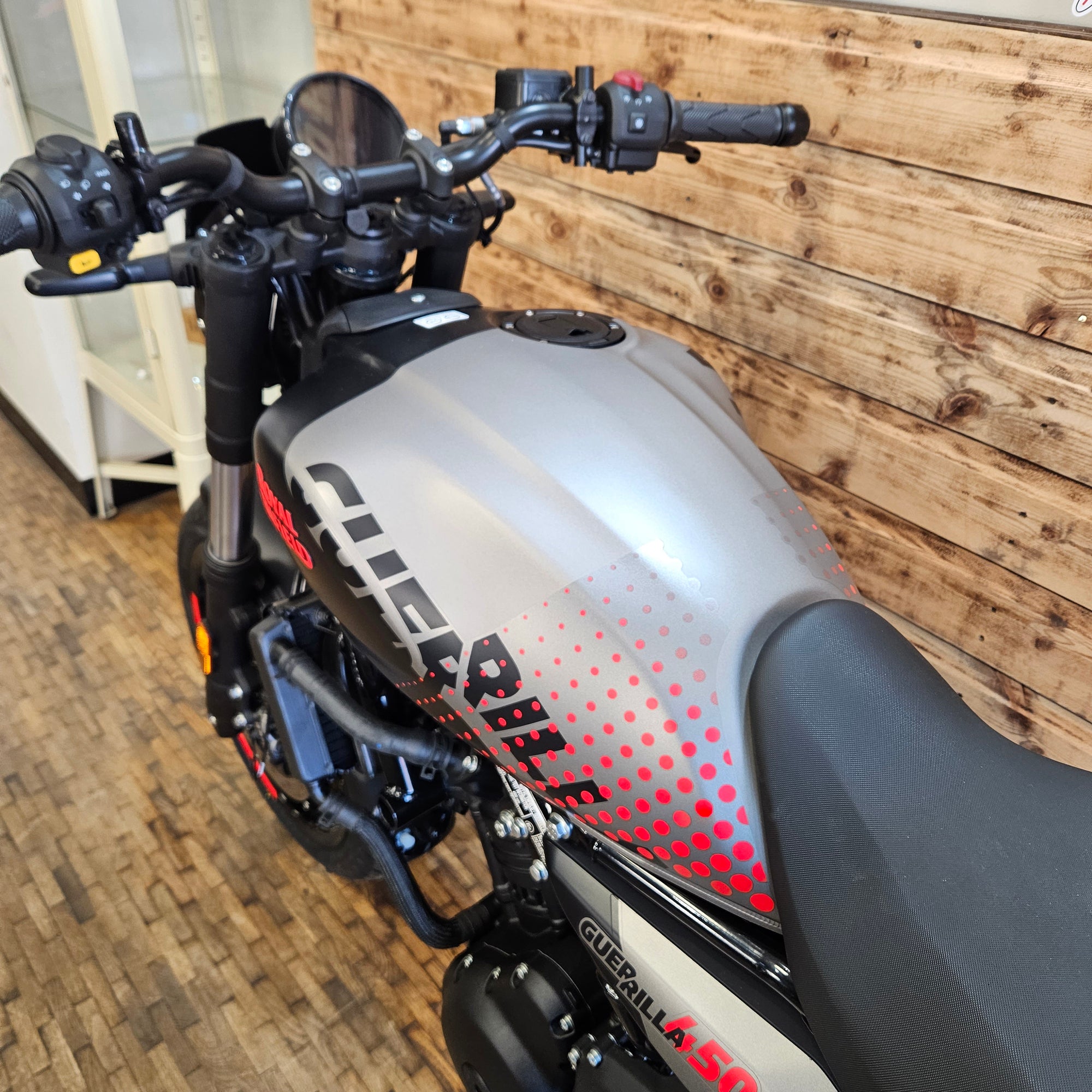 Close-up of a motorcycle with a wooden background