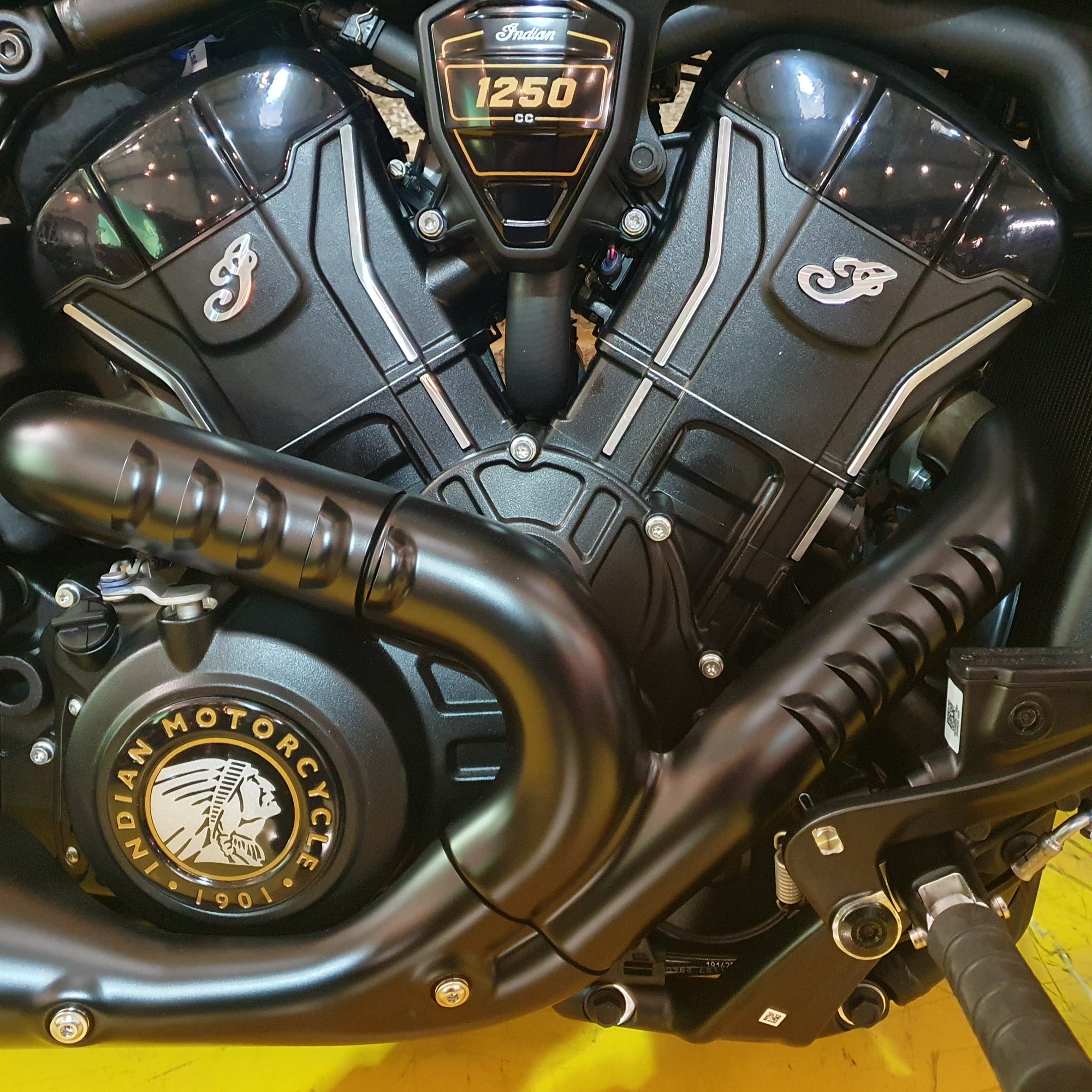 Close-up of a motorcycle engine with 'Indian Motorcycle' branding.