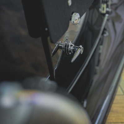 Close-up of a bicycle pedal and chain on a blurred background