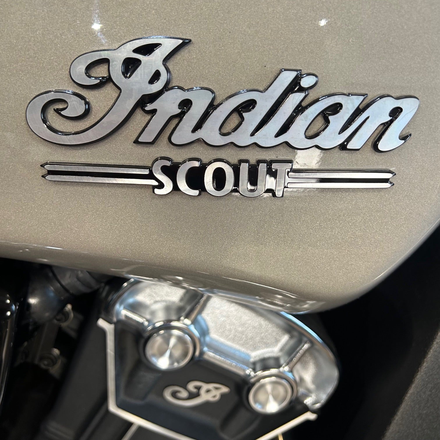 Close-up of an Indian Scout logo on a motorcycle.