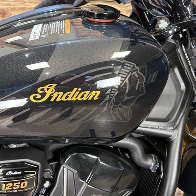 Black motorcycle fuel tank with 'Indian' logo and '1250'cc text.