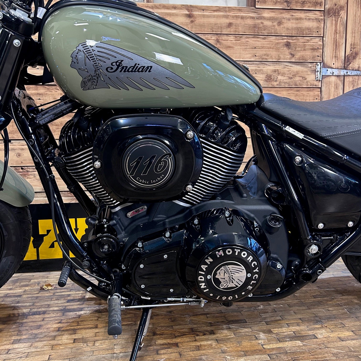 Close-up of an Indian motorcycle engine with a wooden background