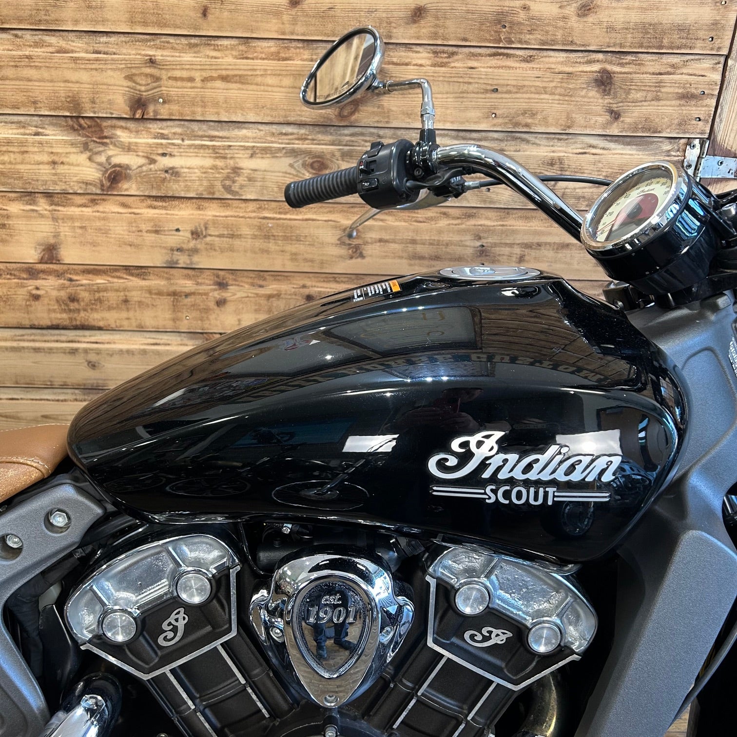 Black Indian Scout motorcycle with wooden background