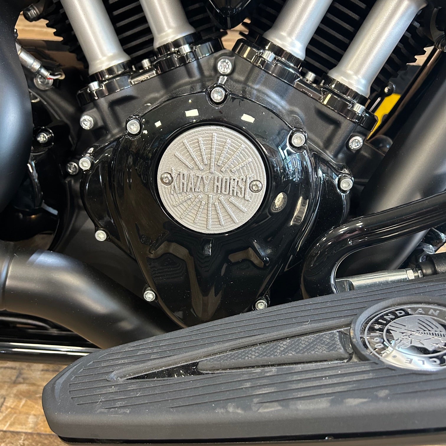 Close-up of a motorcycle engine with 'Harley-Davidson' branding.