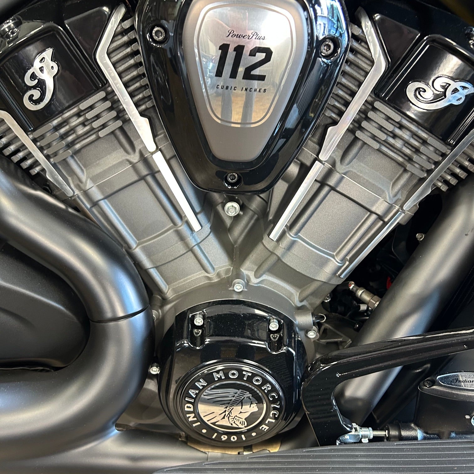 Close-up of a motorcycle engine with 'Indian Motorcycle' branding.