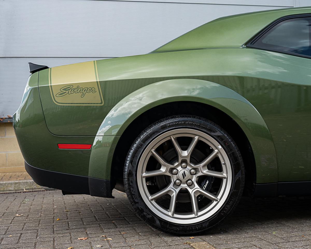 Green muscle car with 'Swinger' branding on a gray background