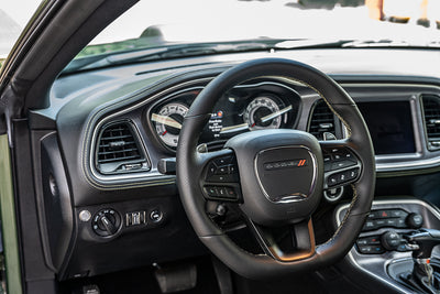 Car interior with steering wheel and dashboard