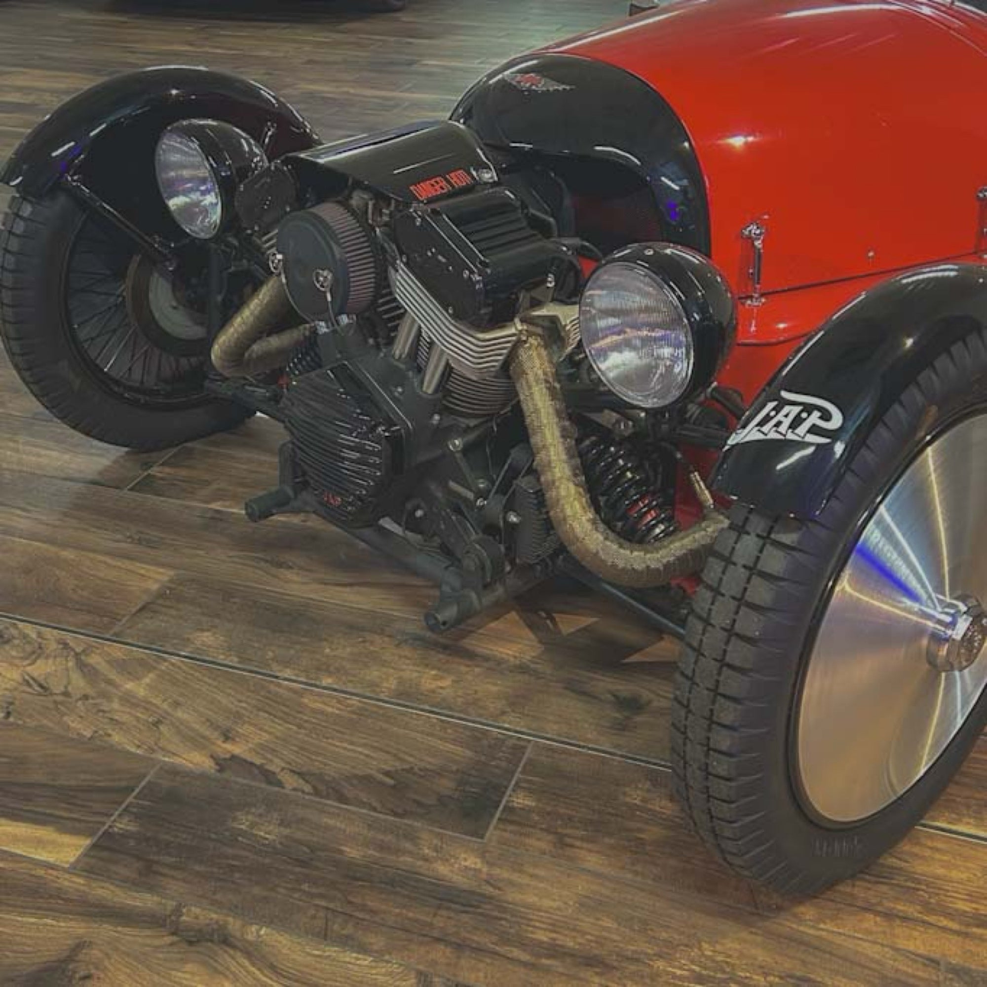Motorcycle with a custom engine on a wooden floor