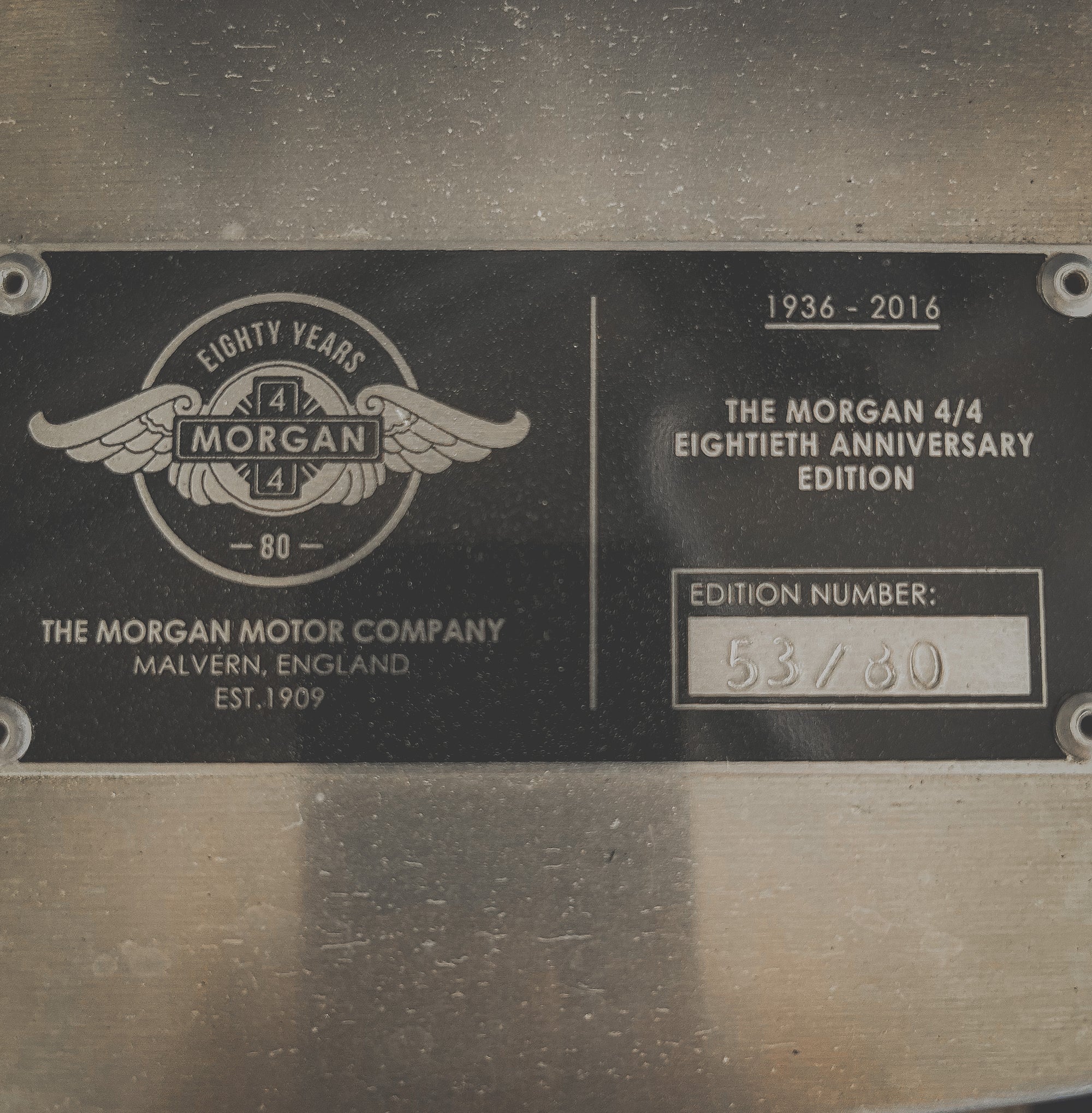 Morgan Motor Company plaque celebrating their 80th anniversary with edition number 53/80.