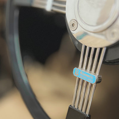 Close-up of a digital caliper with a blurred background