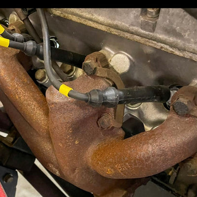 Rust-covered mechanical component with wires and metal parts