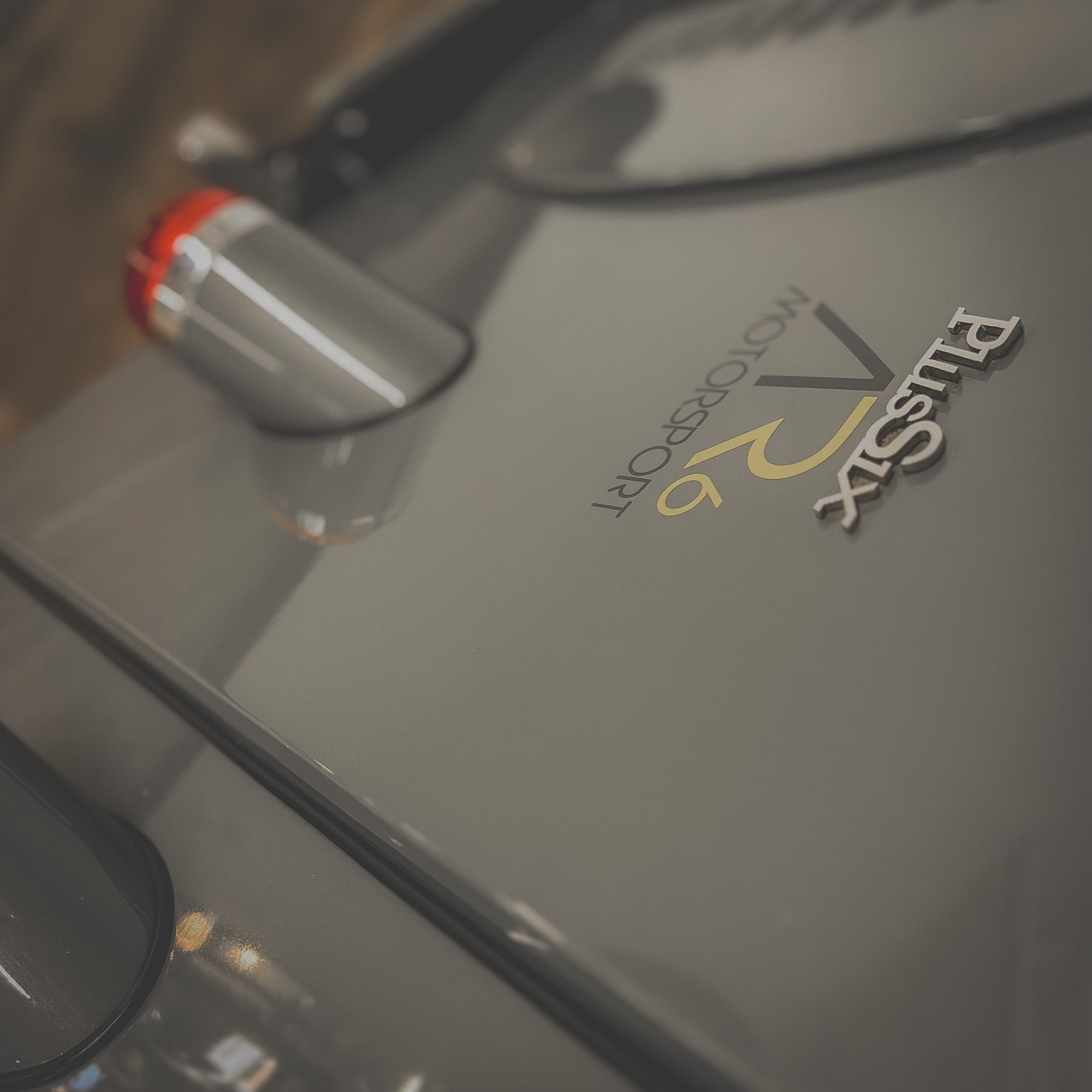 Close-up of a car door with 'Eurasia' logo on a blurred background