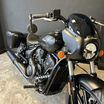 Black motorcycle with 'Indian' branding on a gray background