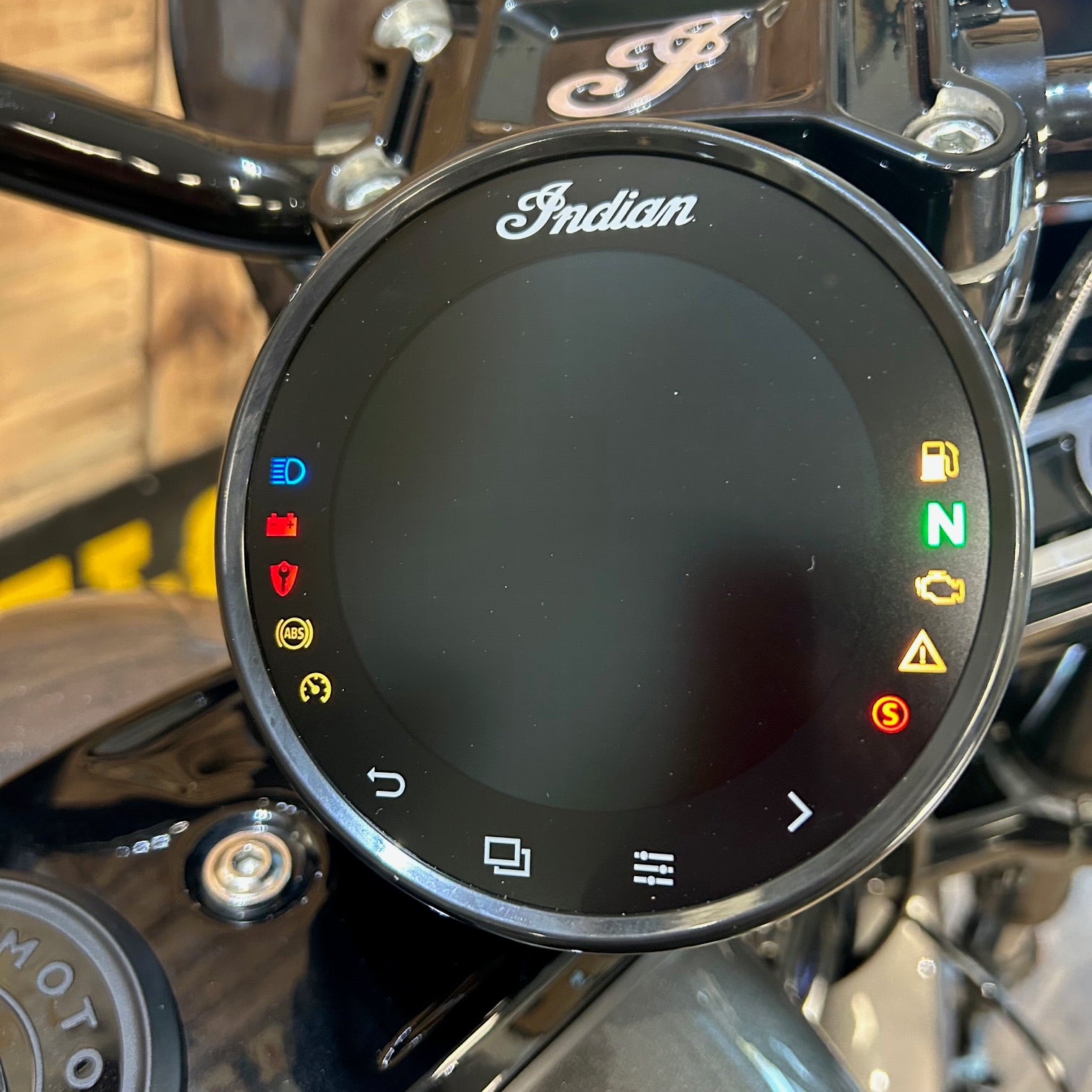 Digital display on a motorcycle with 'Indian' branding