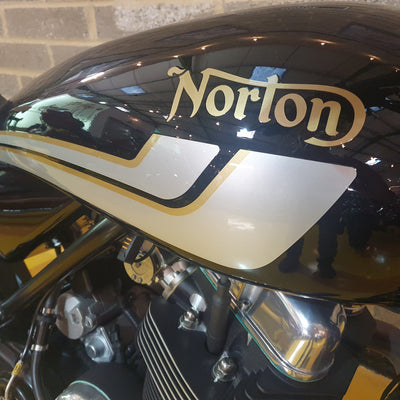 Norton motorcycle fuel tank with gold and white design