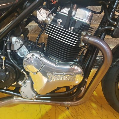 Close-up of a motorcycle engine with 'Vorone' branding on a textured surface.