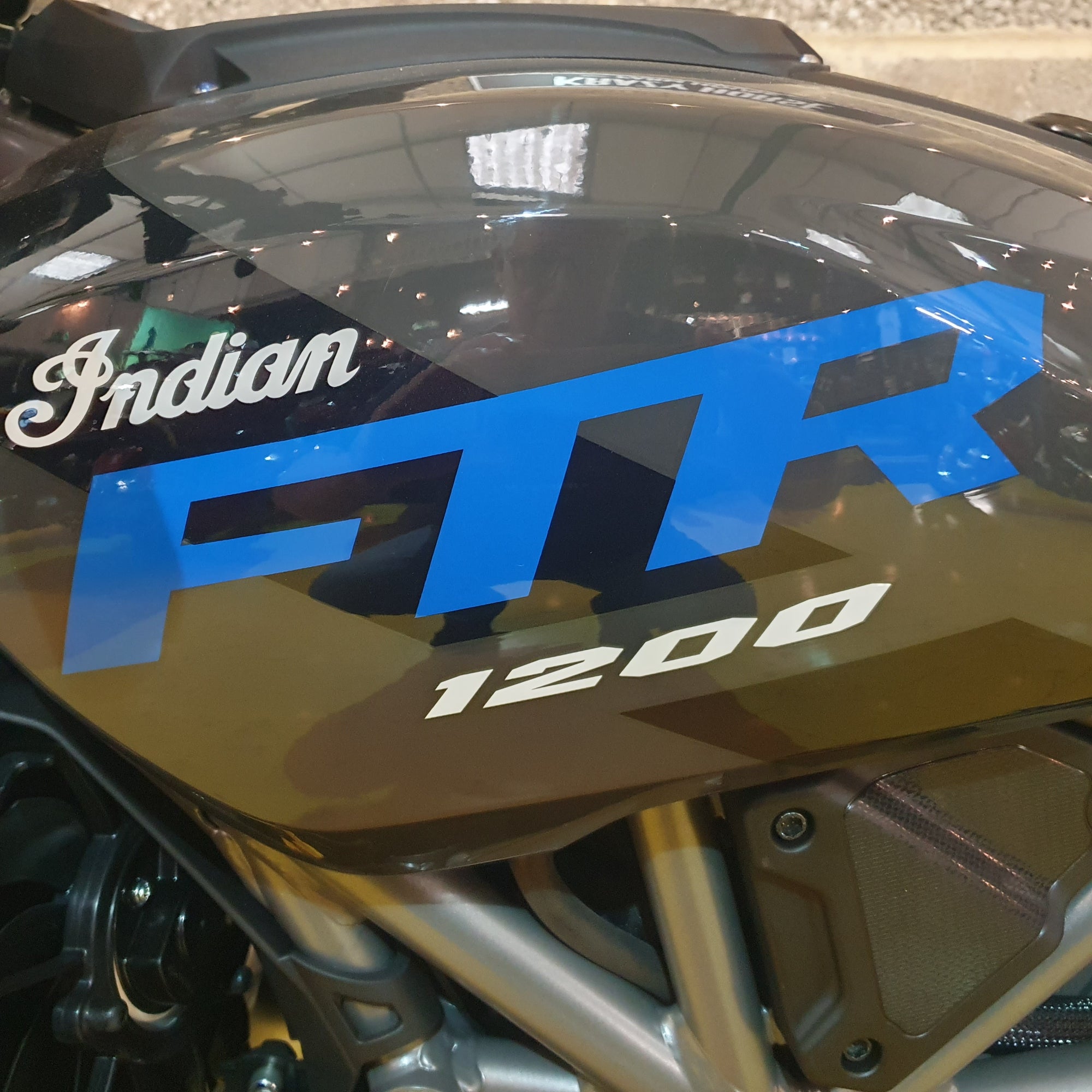 Close-up of a motorcycle with 'Indian FTR 1200' branding.