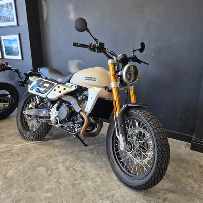 Motorcycle on a stand in a showroom setting