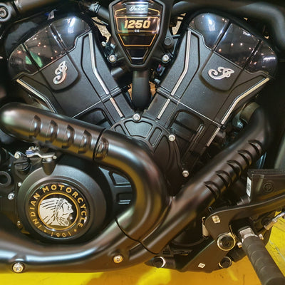 Close-up of a motorcycle engine with 'Indian Motorcycle' branding.