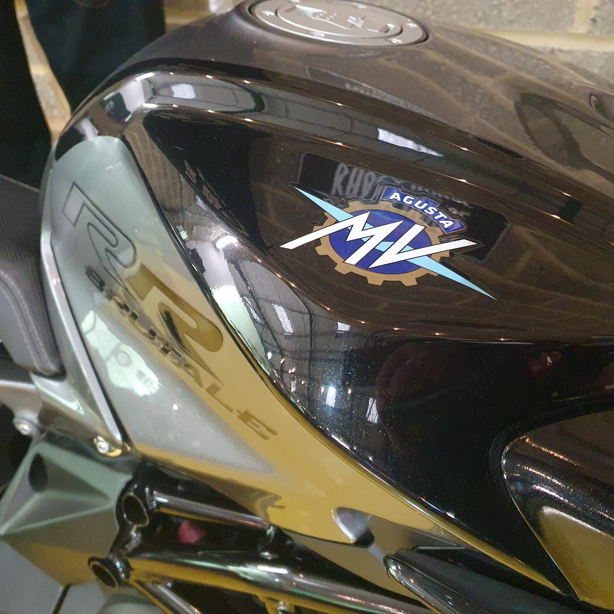 Close-up of a motorcycle with a brand logo on the headlight
