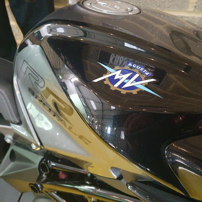 Close-up of a motorcycle with a brand logo on the headlight