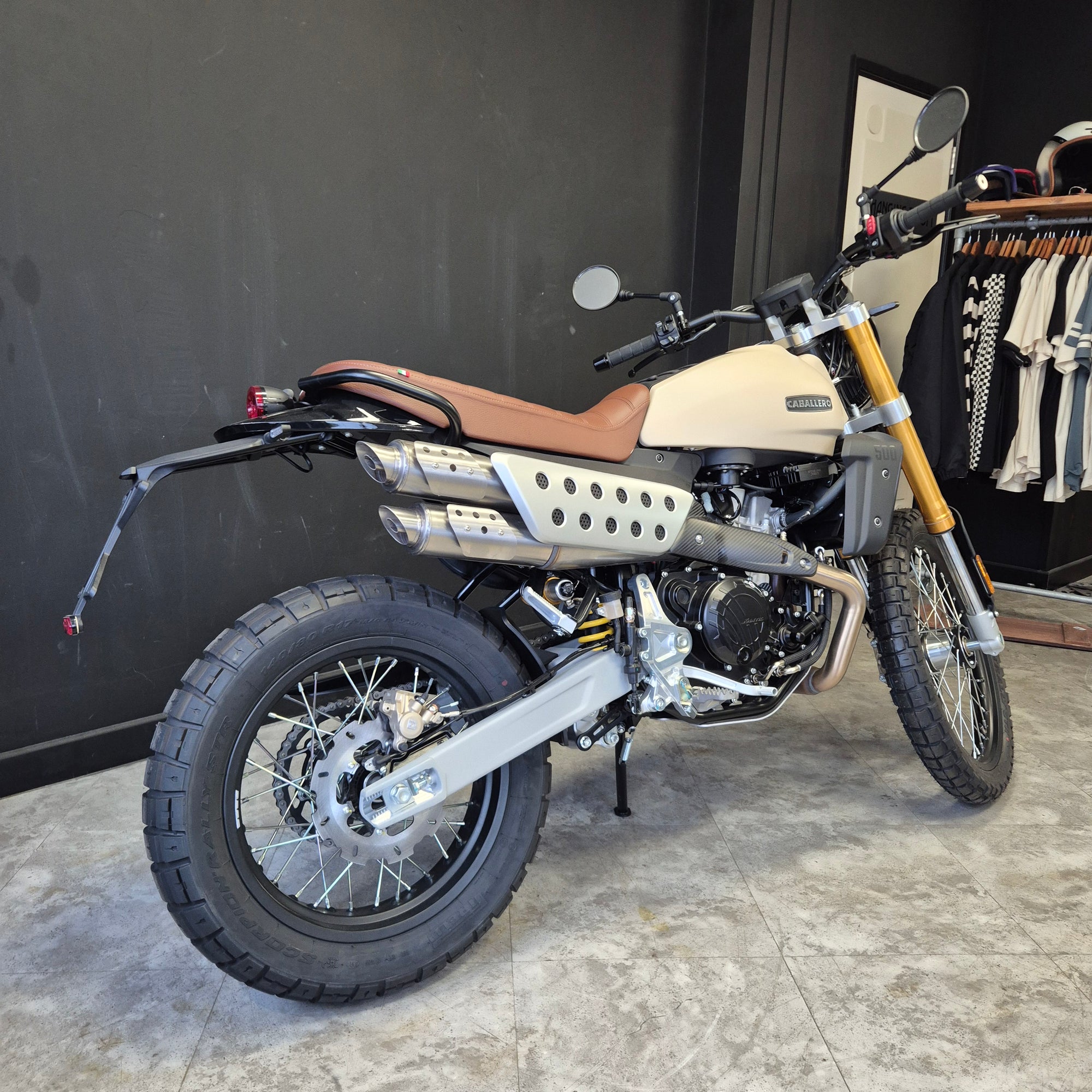 Motorcycle leaning against a wall with a textured surface