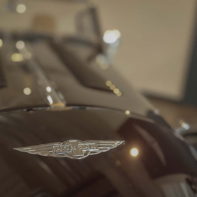 Close-up of a Morgan car emblem on a vehicle.