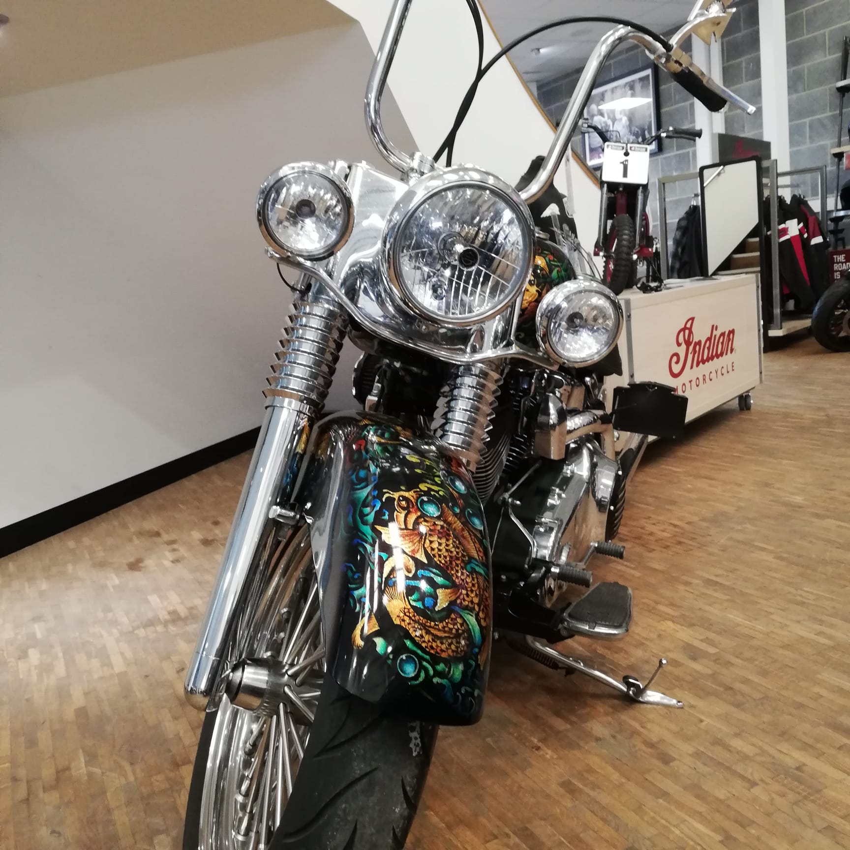 Motorcycle with detailed design on a wooden floor
