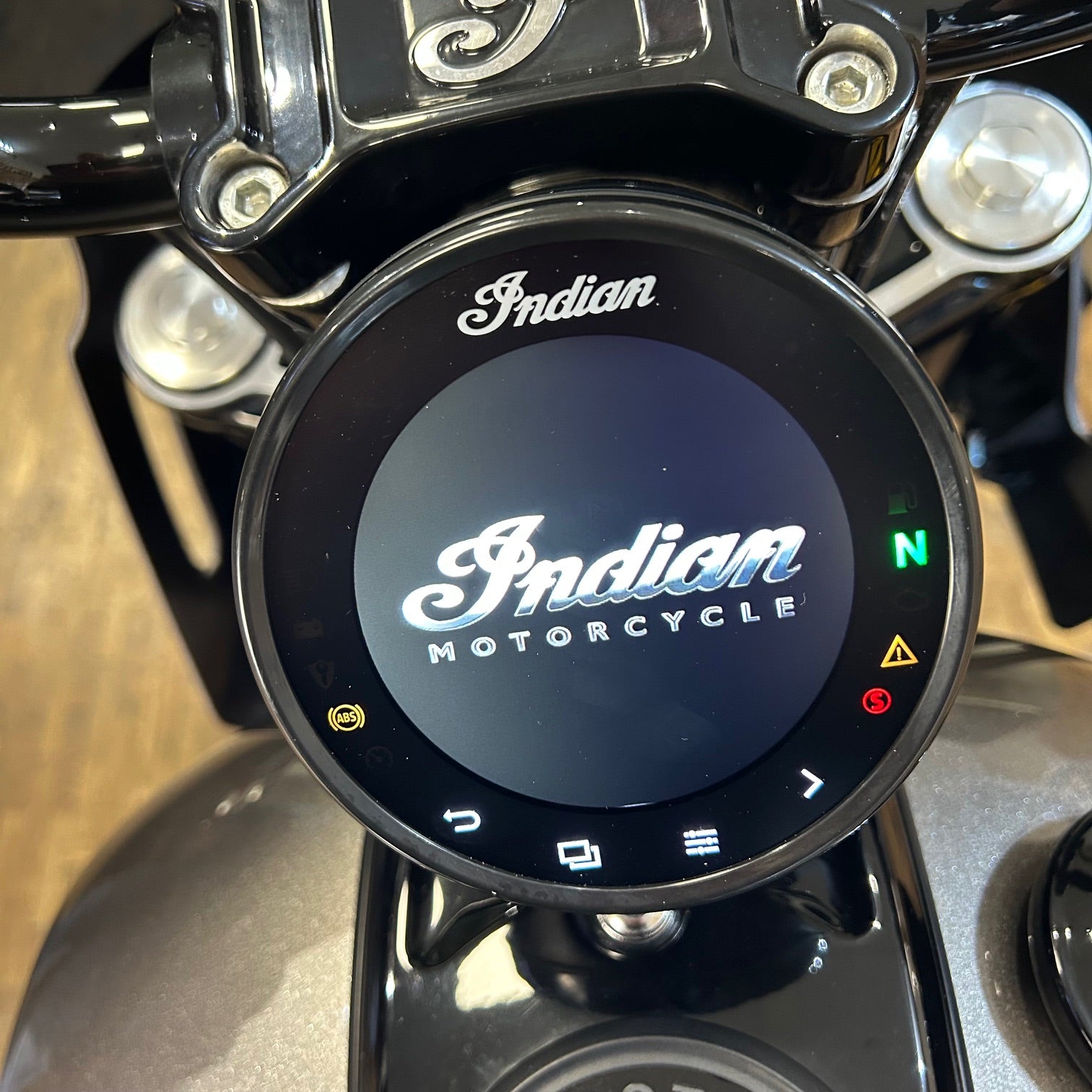 Close-up of an Indian Motorcycle digital display on a motorcycle dashboard.