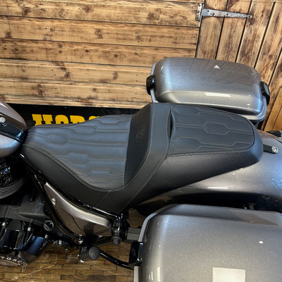 Motorcycle seat with a wooden wall background