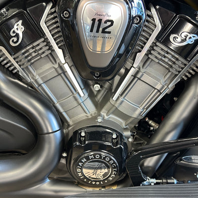 Close-up of a motorcycle engine with 'Indian Motorcycle' branding.