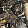 Close-up of a motorcycle ignition switch and surrounding chrome parts.