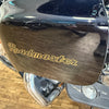 Close-up of a motorcycle with 'Roadmaster' branding on a wooden floor.