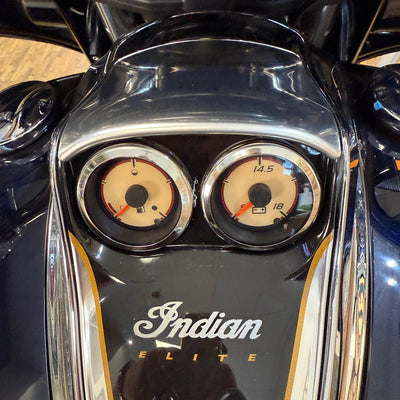 Close-up of a motorcycle with 'Indian Elite' branding on the dashboard.