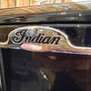 Close-up of a 'Indian' logo on a shiny surface