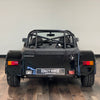 12/12 CATERHAM SEVEN ROADSPORT 150 LARGE CHASSIS - GRAVITY BLACK WITH BLACK LEATHER