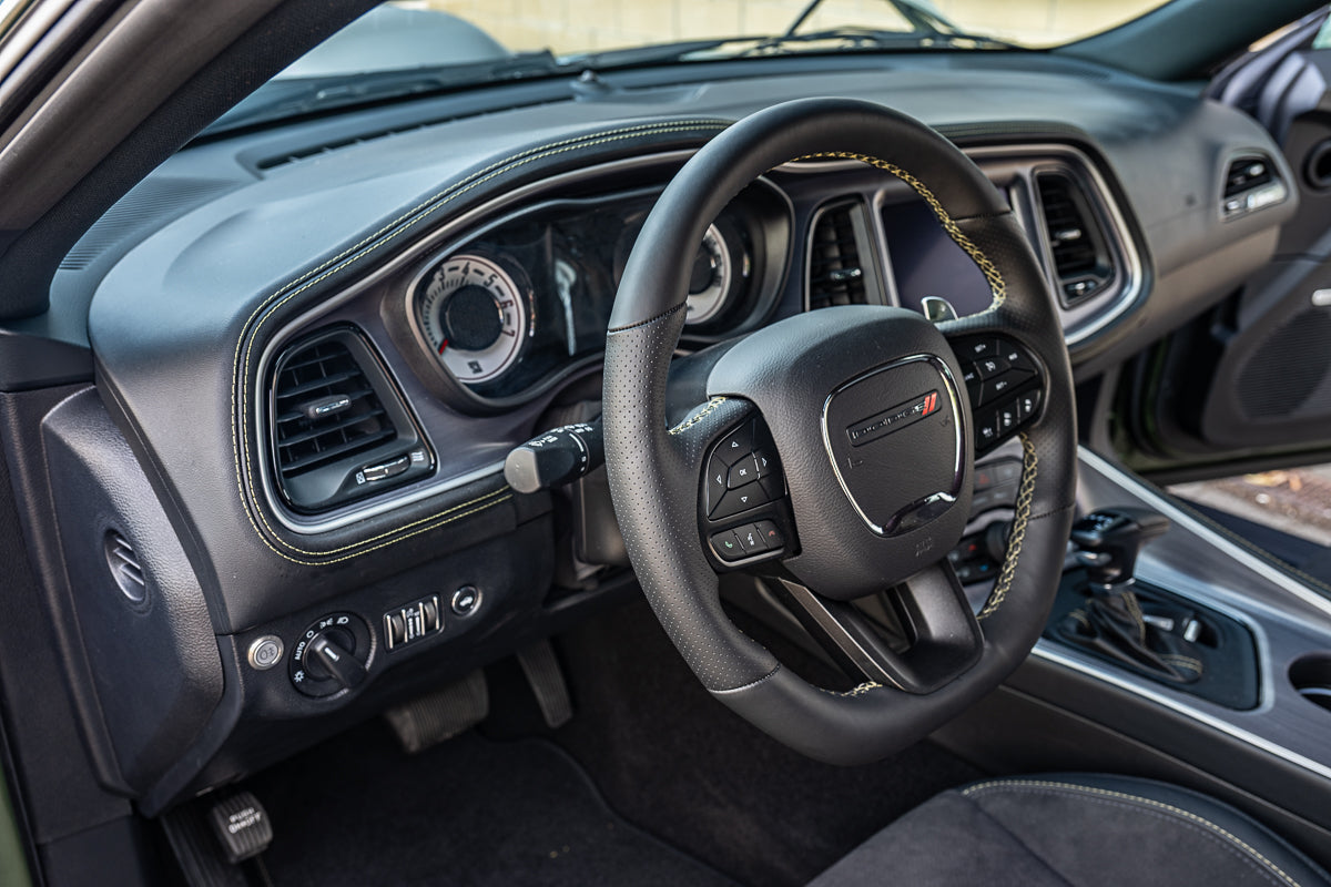 Car interior with steering wheel and dashboard