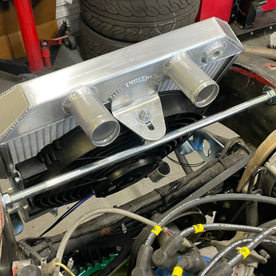 Metallic engine component with pipes and wires on a mechanical background