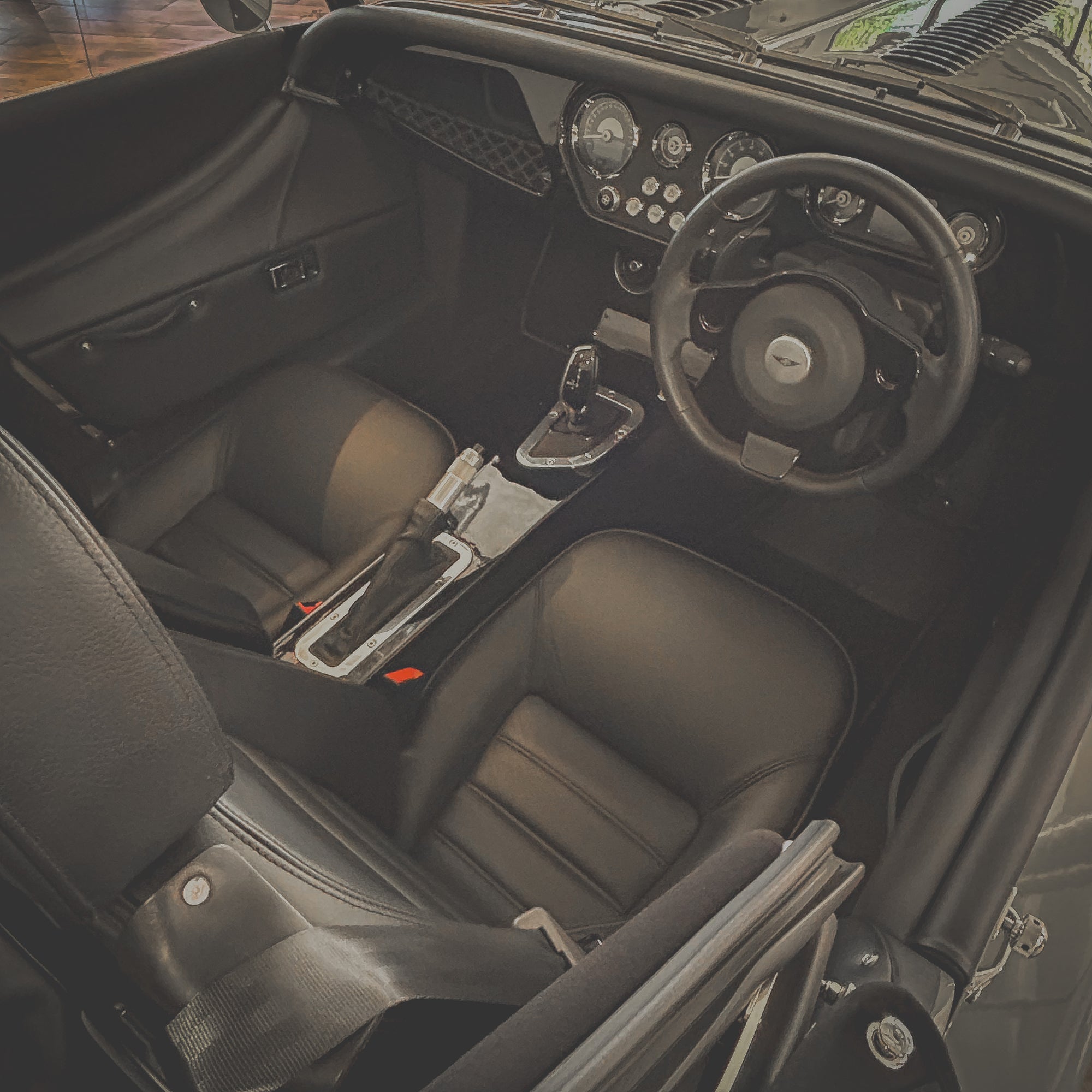 Car interior with steering wheel and dashboard