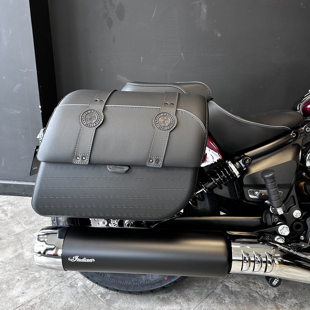 Gray leather saddlebag on a motorcycle with 'Indian' branding.