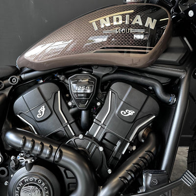 Close-up of an Indian Scout motorcycle engine with 'Indian' branding.