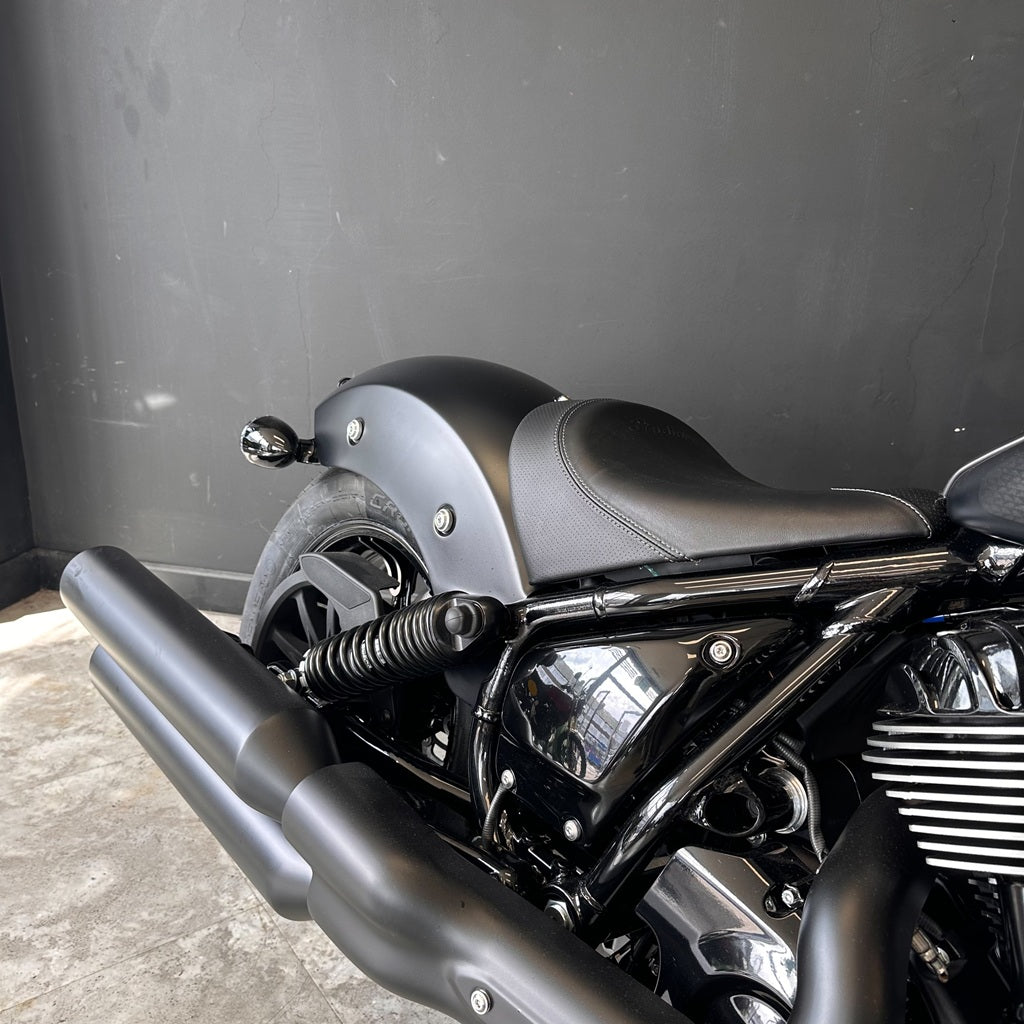 Black motorcycle with a dark gray background