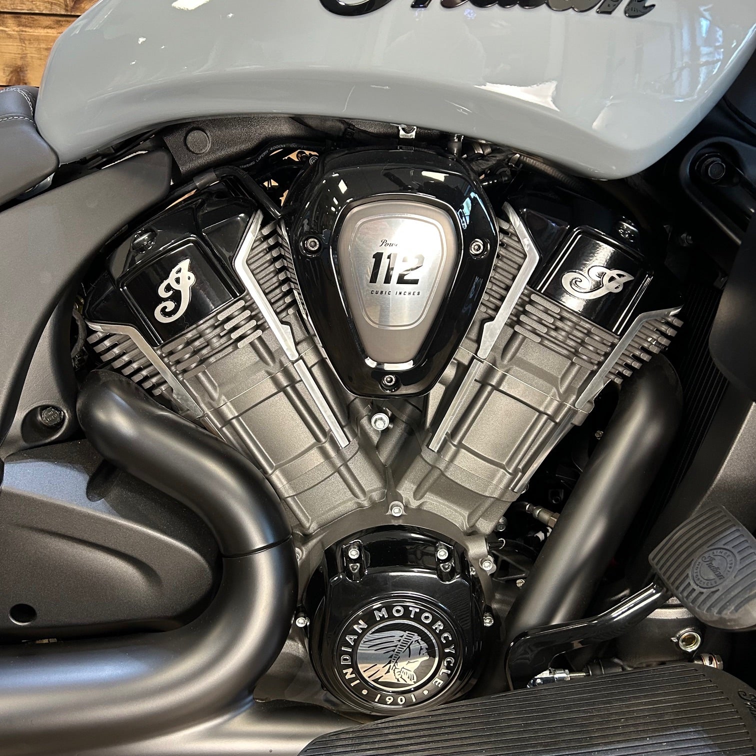 Close-up of a motorcycle engine with 'Indian' branding.